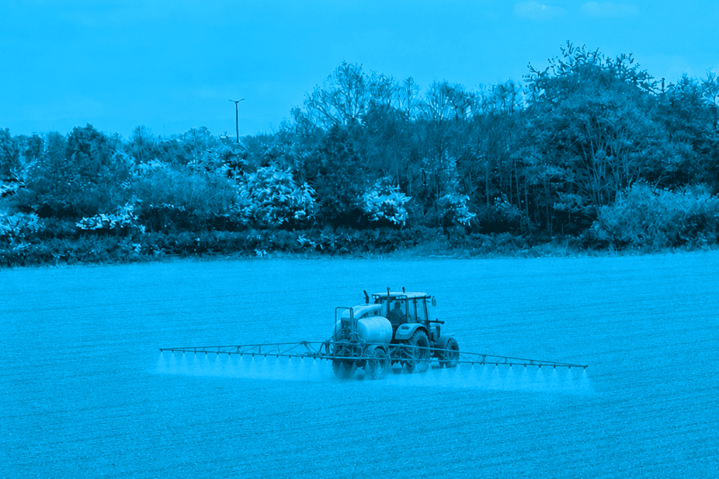 Tractor fertilising field
